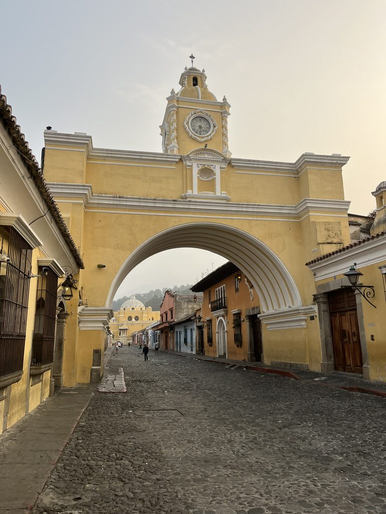The famous yellow arch in the center of town in Antigua, Guatemala
