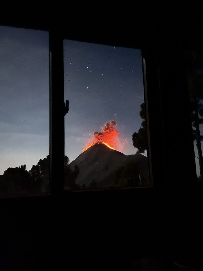 View of erupting Volcan de Fuego from the window of base camp on Volcan Acatenango